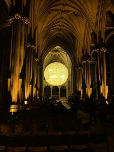 Illuminated sculpture of the sun in Bristol Cathedral